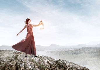 Attractive girl muse with old lantern in hand at summer day - obrazy, fototapety, plakaty
