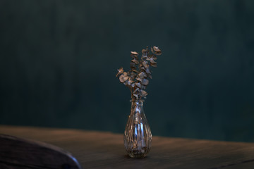 Dry flower and on wooden table for decoration with blur wall background