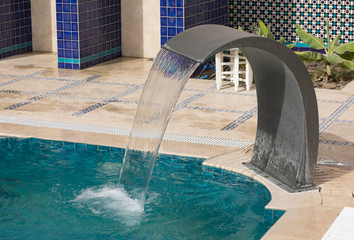 decorative fountain in the swimming pool