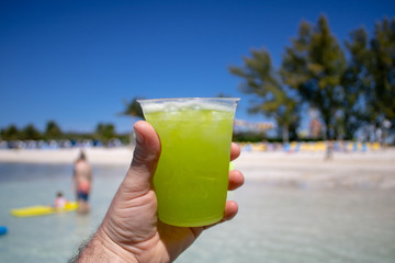 Beautiful orange cocktail on a tropical beach on a sunny day.