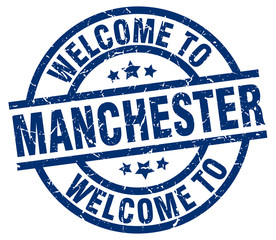 welcome to Manchester blue stamp