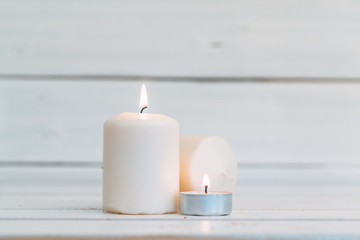 Obraz na płótnie Canvas home lighting candles on wooden table