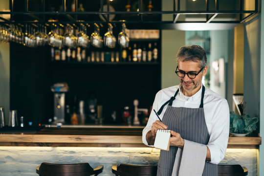 waiter taking order from customers