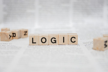 Logic Word Written In Wooden Cube - Newspaper