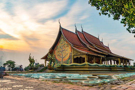 Thailand - Ubon Ratchathani: 10 April 2019: Thai people take family to visit Sirindhorn Wararam Phupha Temple (Wat Phu Phrao) in the evening near a very beautiful temple.
