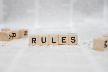 Rules Word Written In Wooden Cube - Newspaper