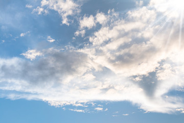 Obraz premium Blue sky with clouds background with sun rays