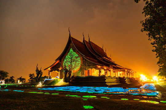 Thailand - Ubon Ratchathani: 10 April 2019: Thai people take family to visit Sirindhorn Wararam Phupha Temple (Wat Phu Phrao) in the evening near a very beautiful temple.