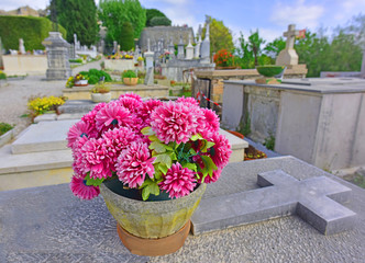 Flowers on gravestone in cemetery in St Paul de Vence, France