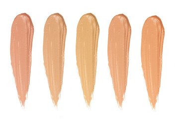 Shades of foundation On White Background. Closeup of different tones of liquid foundation,