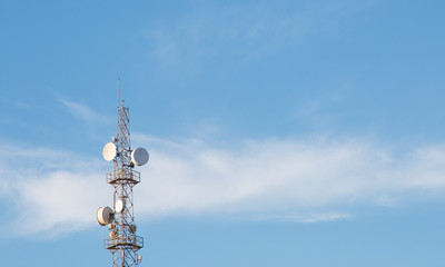 Cellular antenna tower with blue sky in the background