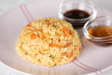 Fried Rice with vegetables and sauce on a plate \ in a bowl