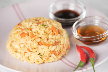 Fried Rice with vegetables and sauce on a plate \ in a bowl