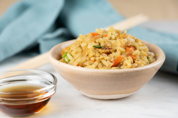 Fried Rice with vegetables and sauce on a plate \ in a bowl