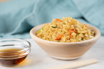 Fried Rice with vegetables and sauce on a plate \ in a bowl