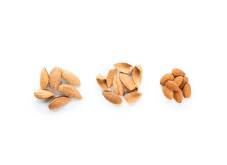 Tasty almonds on white background