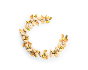 Tasty pistachio nuts on white background
