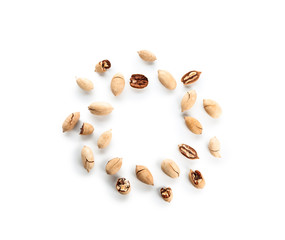 Tasty pecan nuts on white background