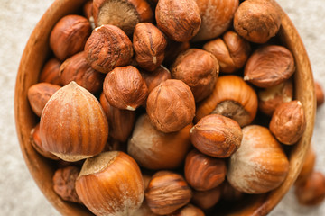 Bowl with tasty hazelnuts, closeup