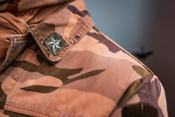 Close up shot of neck area. Details of historical Italian military uniforms. Grades and patches on...