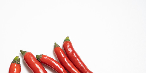 Red chilli isolated in white background with an egg spelling the letter of love