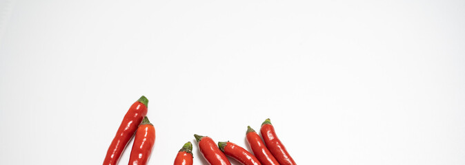 Red chilli isolated in white background with an egg spelling the letter of love