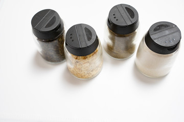 varies seasoning in galss bottle isolated in white