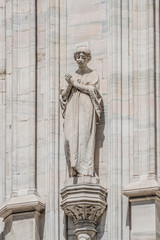 Obraz premium Decorative Religious figure at facade of the Cathedral of Milano, Milan, Italy