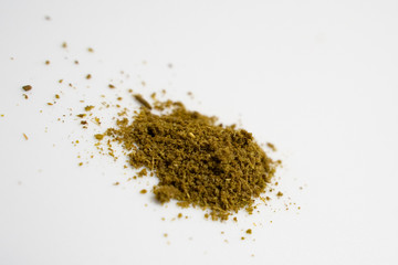 varies seasoning scattered in white background, pepper,shirmp,salt,curry,