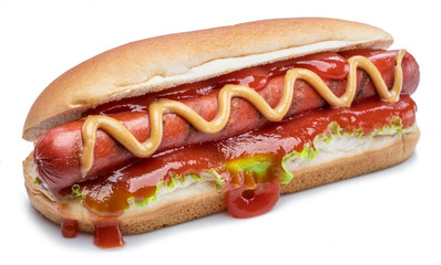Hot dog - grilled sausage in a bun with sauces isolated on white background.