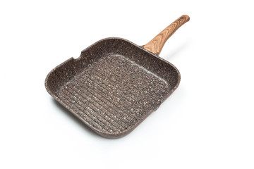Photo of a ceramic Grill frying pan with a wooden handle isolated on a white background. Studio shot