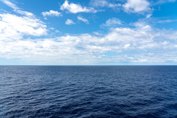 Atlantic Ocean Seascape with blue ocean and a sky filled with clouds  - Powered by Adobe