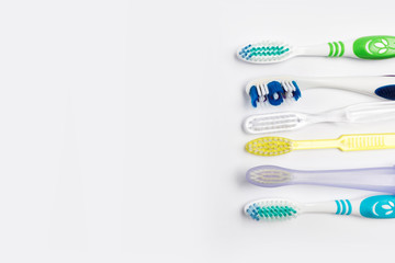 New different  toothbrushes on a white background