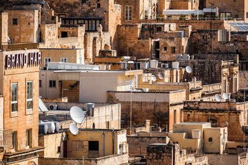 Satellite dishes at roof of buildings