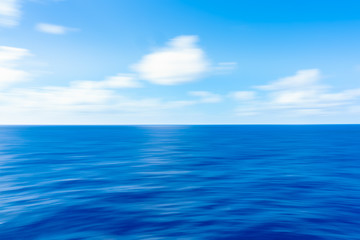 Obraz premium Soft Ocean Waves blue sky and clouds in the background 