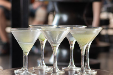 Selective focus of many left over welcome drink in the cocktail glasses