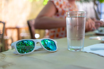 Obraz na płótnie Canvas white sunglasses on the table