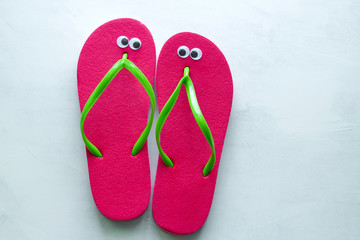 top view summer flat lay flip flops with googly eyes