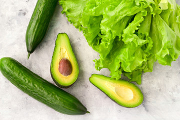 lettuce,avocado and cucumber green food flat lay