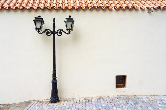 Street Electric Lamp Post At White Wall