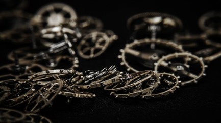 close view of a vintage toothed wheels watch mechanism with jewels
