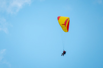 Tandem paragliders flying in the sky