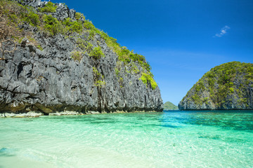 Fototapeta premium Beautiful tropical blue lagoon. Scenic landscape with sea bay and mountain islands, El Nido, Palawan, Philippines