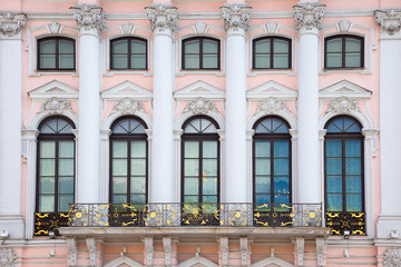  windows and details on an exterior of the building.