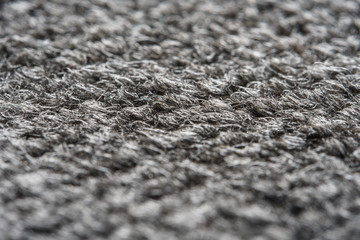 Fototapeta na wymiar Texture of the Gray Nylon Carpet. Textile Background with Copy Space