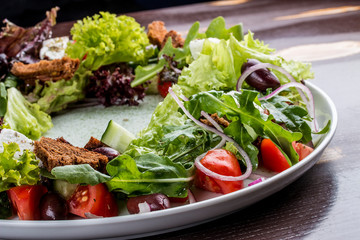 Greek salad on dark background