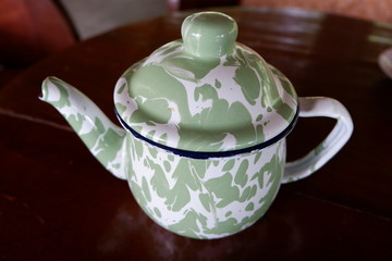 traditional teapots from Indonesia made from zinc and patterned batik