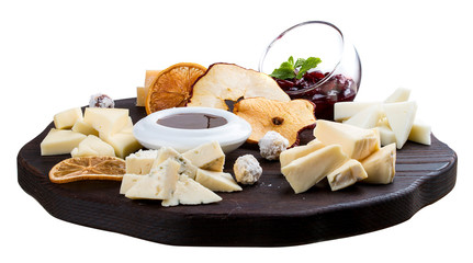 A set of different cheeses on a wooden Board. Cheese Board.