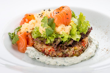 Scramble with quinoa, salmon and Philadelphia cheese. On white background