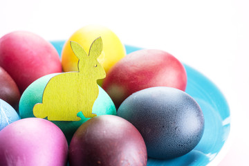 Colorful Easter eggs as an attribute of Easter celebration. Pink background.